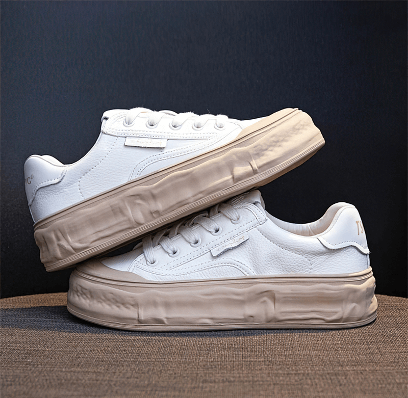White women's round toe lace-up sneakers with thick sole, showcasing stylish comfort and durability.